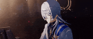 a man with long white hair is sitting in a dark room playing a piano