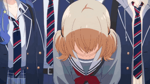 a girl in a school uniform is covering her face