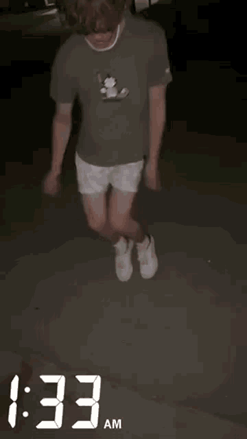 a man wearing shorts and a t-shirt with the time 1:33 am