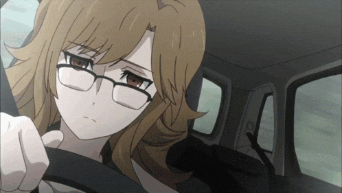 a girl with glasses is sitting in a car