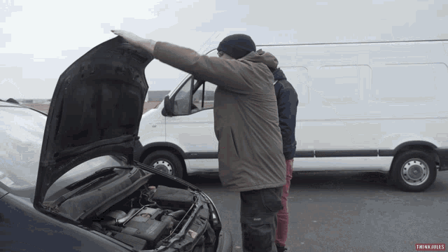 two men are looking under the hood of a car with the words thinkfiles written on the bottom