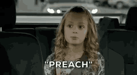 a little girl is sitting in the back seat of a car and saying " preach " .