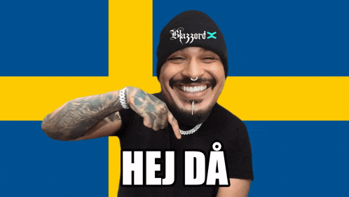 a man wearing a beanie that says blizzard is pointing at the camera
