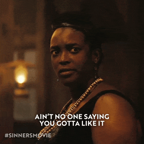 a woman in a black dress says " ain 't no one saying you gotta like it "