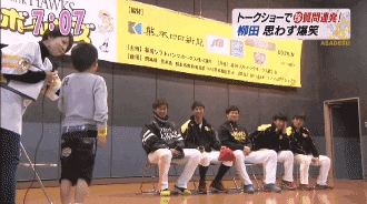 a group of hawks players sit in front of a sign that says 7:07