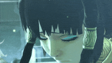 a close up of a woman 's face with her eyes closed and a few earrings on her ears