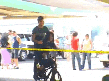 a woman in a wheelchair is being helped by a police officer