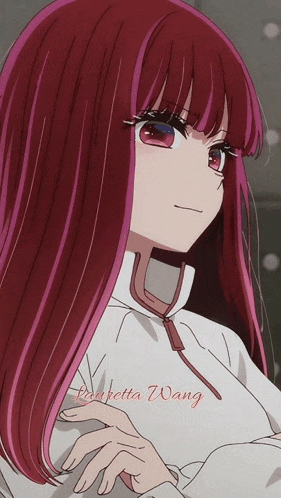 a close up of a girl with red hair and the name lisabetta wang