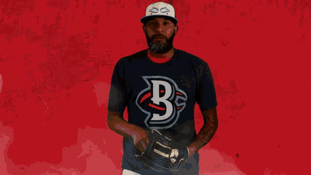 a baseball player wearing a shirt with a letter b on it