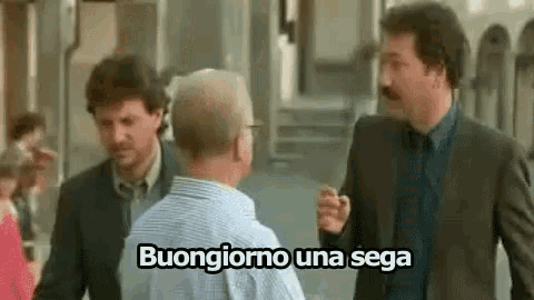 three men are standing next to each other on a street and one of them is saying buongiorno una sega