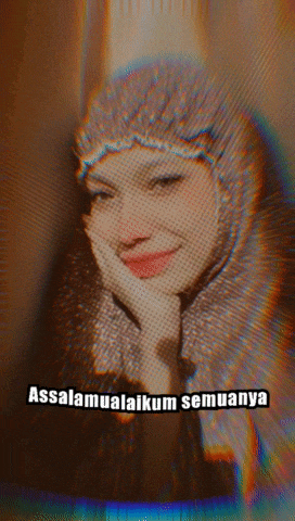 a woman wearing a hijab is smiling with the words assalamualaikum semuanya written below her