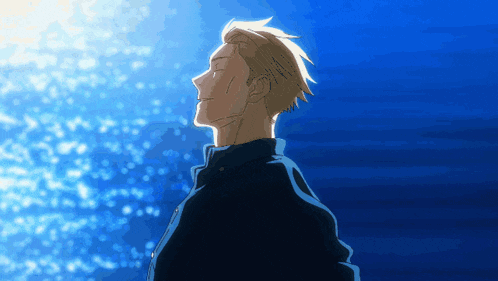 a man stands in front of a blue background and looks up at the sky