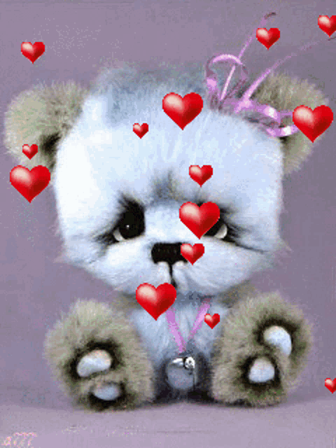 a teddy bear is surrounded by red hearts and a pink bow