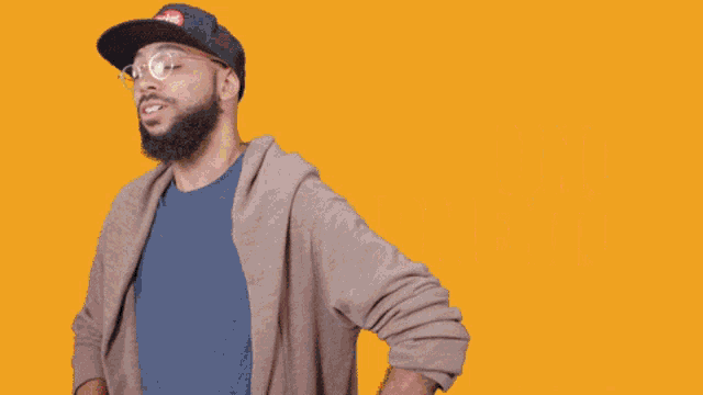 a man wearing a hat that says " sticker bomb " on it