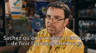 a man wearing glasses and a yellow shirt with the words sachez qu ' on a vraiment envisage