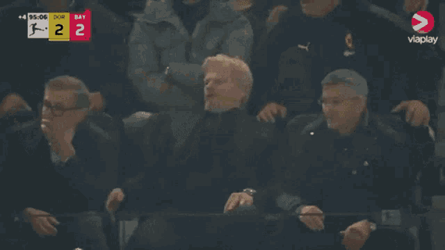 a soccer game between dortmund and bay is being played