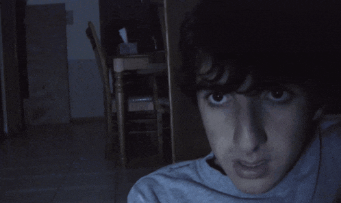 a person 's neck is shown in the dark