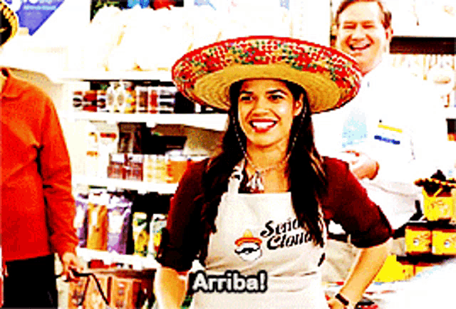 a woman wearing a sombrero and an apron that says ' señor claus '