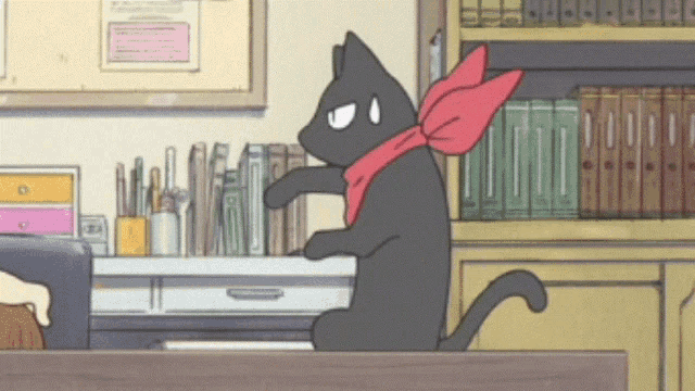 a cartoon cat with a red scarf around its neck