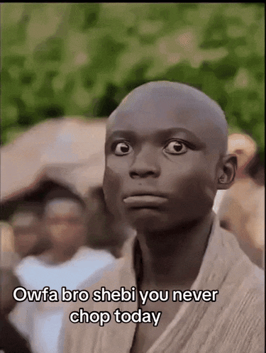 a man with a shaved head says " owfa bro shebi you never chop today " in front of a crowd