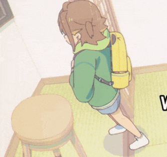 a girl in a green jacket and shorts stands next to a stool