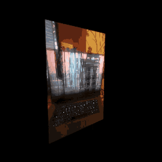 a dell laptop is open to a screen that shows a cityscape