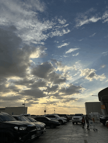 a lot of cars are parked in a parking lot