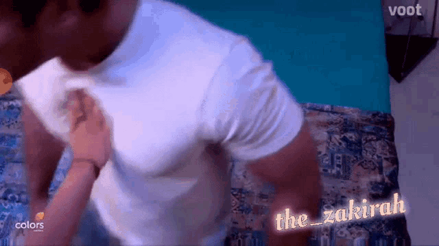 a man in a white shirt is being punched in the face by a woman .