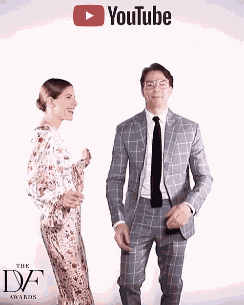 a man and a woman are dancing in front of a youtube banner
