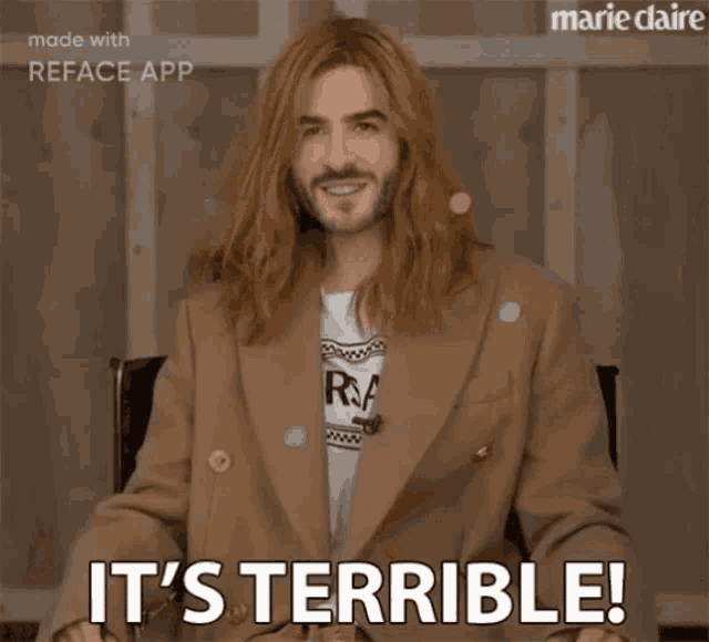 a man with long hair says it 's terrible on a screen