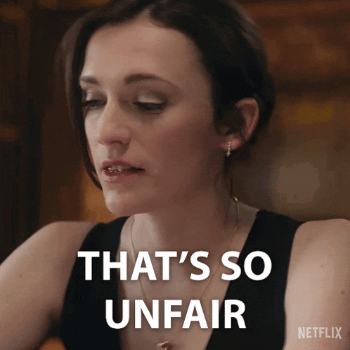 a woman says that 's so unfair with a netflix logo behind her