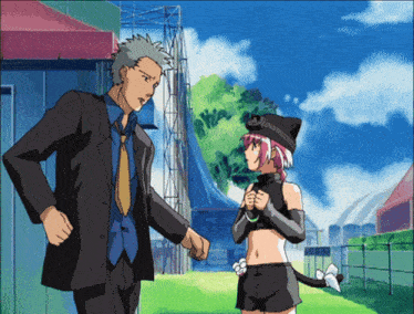 a man in a suit and tie talks to a girl in a cat outfit