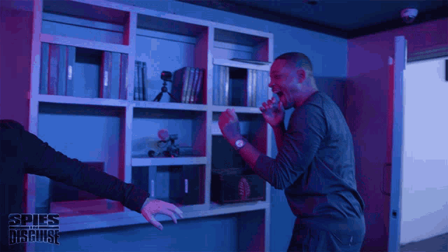 two men are fighting in a room with spies disguise written on the bottom right