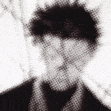 a black and white photo of a man 's face