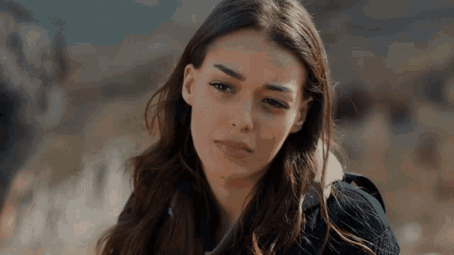 a woman with a sad look on her face