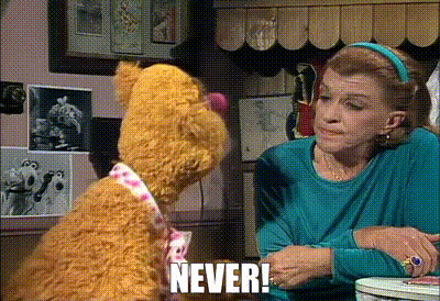 a woman talking to a teddy bear that says " never " on it