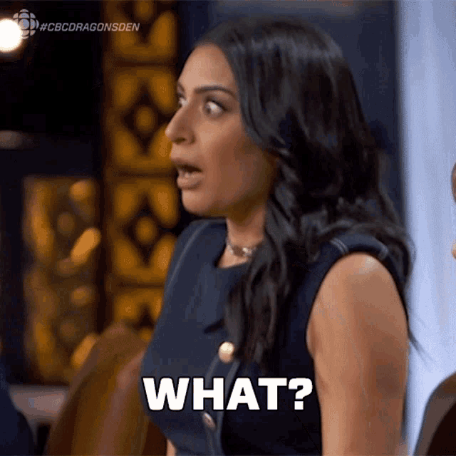 a woman with a surprised look on her face is saying " what "