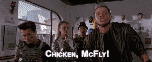 a group of people standing in a room with the words chicken mcfly written on the bottom