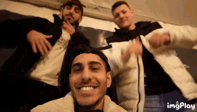 a group of young men are posing for a picture with imgplay written below them