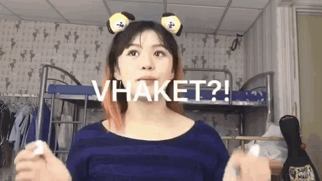 a woman wearing a headband that says " vhaket " on it