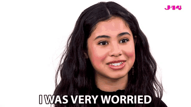a girl says i was very worried in front of a pink j-14 logo