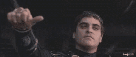 a police officer is holding a gun in front of his face and says `` ban him '' .