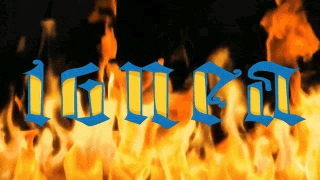 a blue and yellow sign that says ' i am a ' in front of a fire