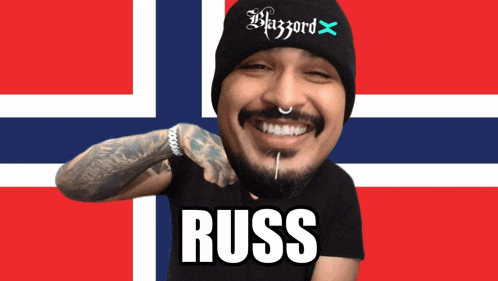 a man with a beard wearing a black beanie and a black shirt that says russ