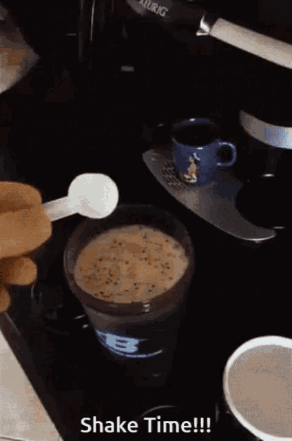 someone is pouring powder into a shaker that says shake time on it