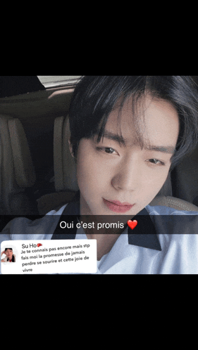 a picture of a young man with a heart and the words oui c'est promis on the bottom
