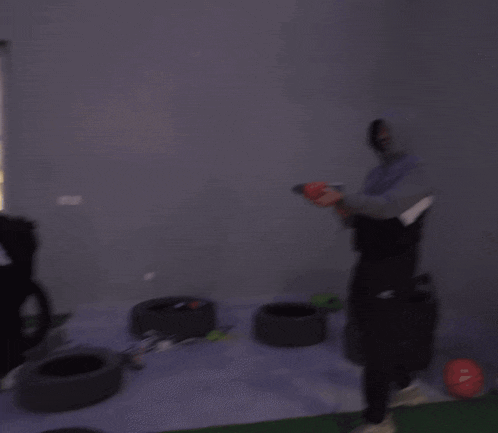 a blurry picture of a man wearing a white shirt that says ' a ' on the back