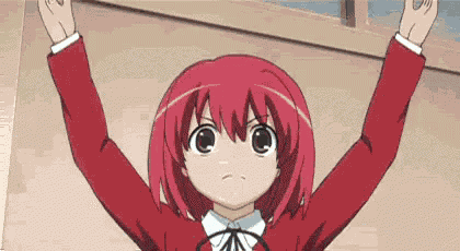 a girl with red hair is raising her hands in the air .