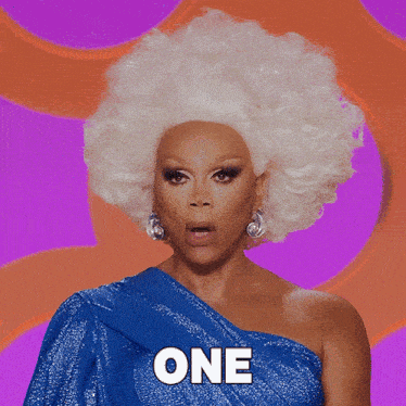 a drag queen with white hair and a blue dress has the word chance in white letters