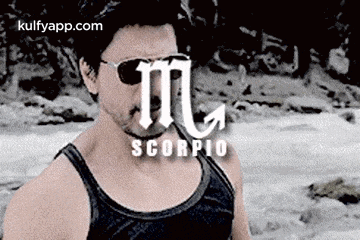 a man wearing sunglasses and a tank top is a scorpio sign